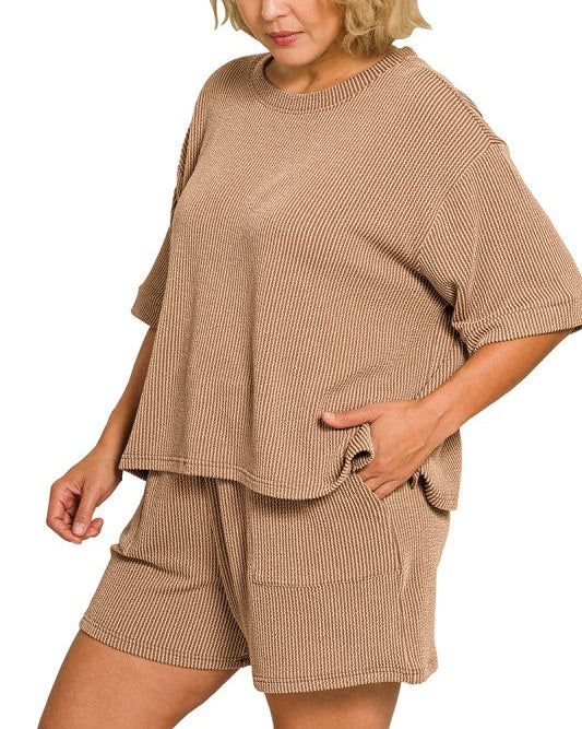 Woman wearing a brown ribbed lounge set on a white background